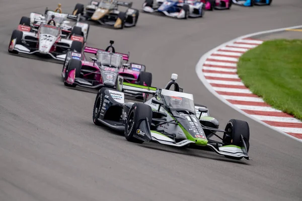 stock image INDYCAR Series driver, Takuma Sato (11) of Tokyo, Japan, races through the turns during the Bommarito Automotive Group 500 at World Wide Technology Raceway in Madison IL.