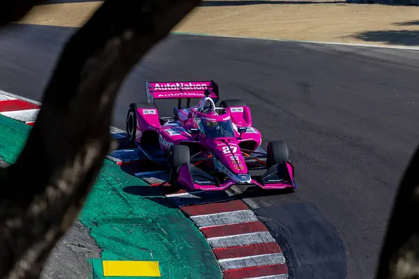 stock image INDYCAR Series driver, KYLE KIRKWOOD (27) of Jupiter, Florida, travels through the turns during a practice session for the Firestone Grand Prix of Monterey at WeatherTech Raceway Laguna Seca in Monterey CA.