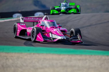 INDYCAR Serisi sürücüsü, Jüpiter, Florida 'dan KYLE KIRKWOOD (27), Monterey' deki WeatherTech Raceway Laguna Seca 'da düzenlenen Firestone Grand Prix tatbikatı sırasında virajlardan geçer..