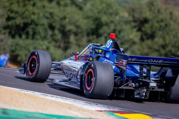 stock image INDYCAR Series driver, ALEX PALOU (10) of Barcelona, Spain, travels through the turns during a practice session for the Firestone Grand Prix of Monterey at WeatherTech Raceway Laguna Seca in Monterey CA.