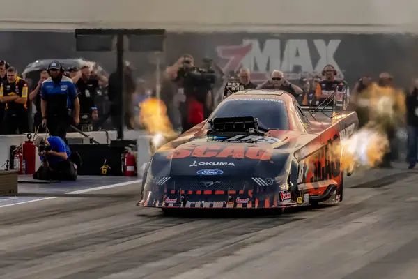 Stock image Sep 22, 2023-Concord, NC:  NHRA Funny Car Series driver, Cruz Pedregon, runs down the lane during a qualifying session for the Betway Carolina Nationals.