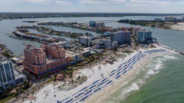Capturing Clearwater Beach vibrant Spring Break from abovea drones perspective reveals sun kissed shores, lively crowds, and joyful beachgoers savoring the warmth of a perfect spring day. clipart