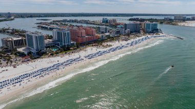Capturing Clearwater Beach vibrant Spring Break from abovea drones perspective reveals sun kissed shores, lively crowds, and joyful beachgoers savoring the warmth of a perfect spring day. clipart