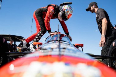 SANTINO FERRUCCI (14) of Woodbury, Connecticut sits in his car prior to a run during the Sebring Open Test at Sebring International Raceway in Sebring FL. clipart