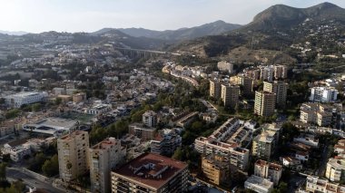 Aerial view of Malaga: nestled between Gibralfaro Hill and Guadalmedina, historic yet vibrant, with 2800 years of history, it's a coastal gem on Spain's Costa del Sol. clipart
