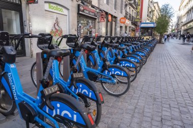 Electric bikes in Madrid redefine urban mobility, offering eco-friendly transport amidst bustling streets. clipart
