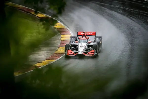 Stock image WILL POWER (12) of Toowoomba, Australia comes through turn 12 (Canada Corner) during a wet practice session for the XPEL Grand Prix at Road America in Elkhart Lake, WI.