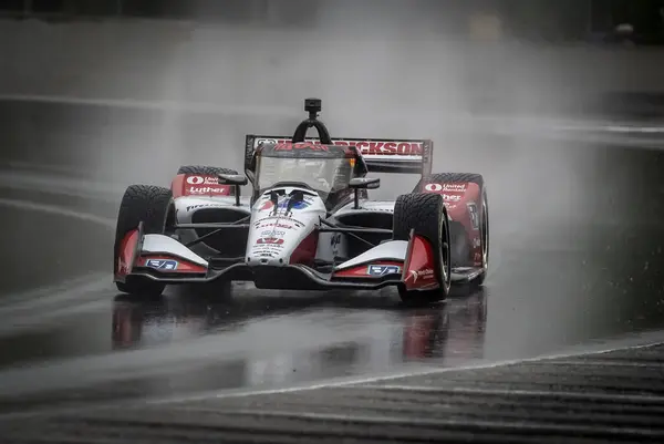 stock image GRAHAM RAHAL (15) of New Albany, Ohio comes through turn 12 (Canada Corner) during a wet practice session for the XPEL Grand Prix at Road America in Elkhart Lake, WI.