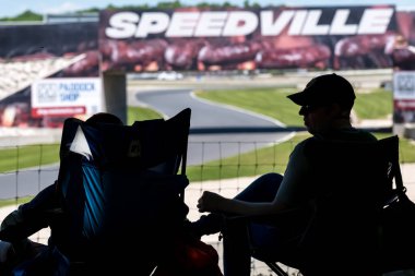 Fans watch their favorite drivers race through the Road America, in the XPEL Grand Prix, an exhilarating event showcasing high-speed action and skill in the heart of Elkhart Lake, WI. clipart