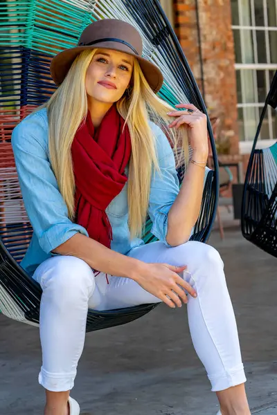 stock image Blonde beauty exudes joy in stylish fall attire, radiating high spirits on a stunning autumn day.