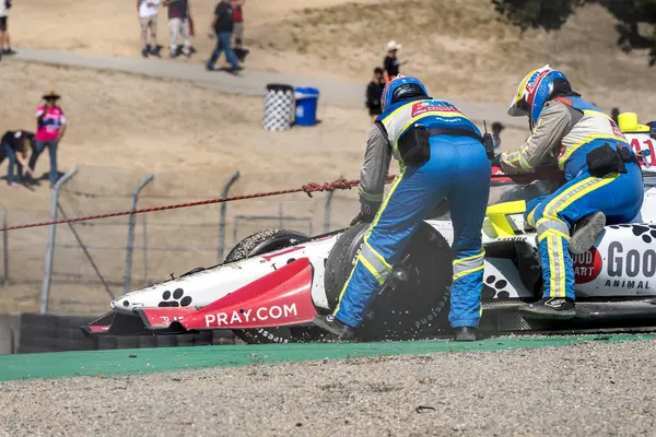 stock image The AMR Safety Crew work on the accident site by STING RAY ROBB (41) of Payette, Idaho as he brings out a caution  during a practice session for the Firestone Grand Prix of Monterey at WeatherTech Raceway Laguna Seca in Salinas, CA.