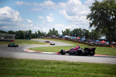 Jüpiter, Florida 'dan KYLE KIRKWOOD (27), Lexington OH' daki Orta Ohio Spor Otomobil Kursu 'nda Honda Indy 200 yolunda ilerliyor..