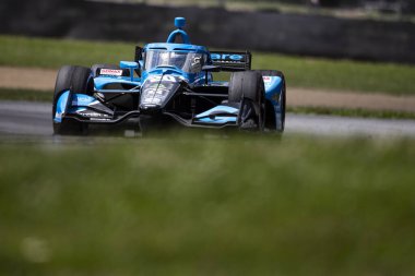 Kopenhag, Danimarka 'dan CHRISTIAN RASMUSSEN (R) (20), Lexington OH, Ohio' daki Orta Ohio Spor Araba Kursunda Honda Indy 200 yolunda ilerliyor..