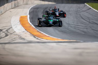 NOLAN SIEGEL (R) (78) of Palo Alto, California drives on track during a practice session for the XPEL Grand Prix at the Road America in Elkhart Lake WI. clipart