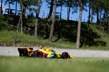 ALEX PALOU (10) of Barcelona, Spain drives on track during a practice session for the XPEL Grand Prix at the Road America in Elkhart Lake WI. clipart