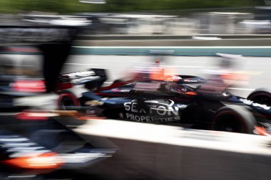 SANTINO FERRUCCI (14) of Woodbury, Connecticut drives on pit road during a practice for XPEL Grand Prix at the Road America in Elkhart Lake WI. clipart