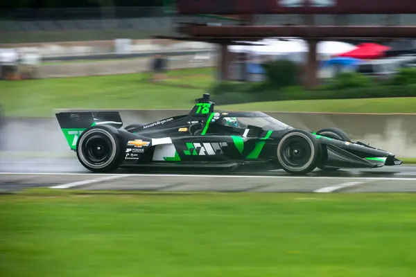 stock image NOLAN SIEGEL (R) (78) of Palo Alto, California drives on track during a practice session for the XPEL Grand Prix at the Road America in Elkhart Lake WI.