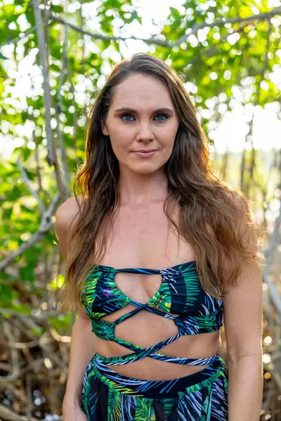 Stock image Stunning model graces Central Mexico's mangrove fields in a picturesque vacation pose, blending natural beauty with serene surroundings.