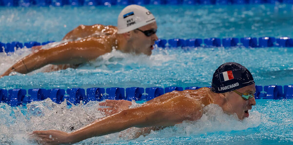 Leon Marchand (FRA) of France, swims in the Men's 200m Butterfly Semifinals at the Paris La Defense Arena during the 2024 Paris Summer Olympics in Paris, France.