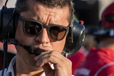 NTT INDYCAR SERIES team owner, RICARDO JUNCOS, watches as his teams prepare for the Bommarito Automotive Group 500 at World Wide Technology Raceway in Madison, IL. clipart