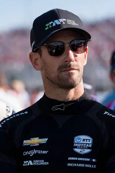 stock image NTT INDYCAR SERIES driver, ROMAIN GROSJEAN (77) (SWE) of Geneva, Switzerland stands for the national anthem before the Bommarito Automotive Group 500 at World Wide Technology Raceway in Madison IL.