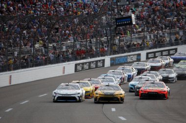 Aug 11, 2024-Richmond , VA;  Denny Hamlin races down the front stretch for the Cook Out 400 in Richmond , VA, USA clipart