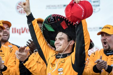 NTT INDYCAR SERIES PATO OWARD (5) (MEX) of Monterey, Mexico celebrates his win for the Hy-Vee Milwaukee Mile 250's at The Milwaukee Mile in West Allis, WI. clipart