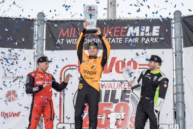 NTT INDYCAR SERIES PATO OWARD (5) (MEX) of Monterey, Mexico celebrates his win for the Hy-Vee Milwaukee Mile 250's at The Milwaukee Mile in West Allis, WI. clipart