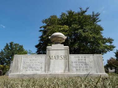 Margaret Mitchell's burial site is in Atlanta's historic Oakland Cemetery. A simple headstone honors the famed author of Gone with the Wind, surrounded by lush greenery and the city's rich history. clipart