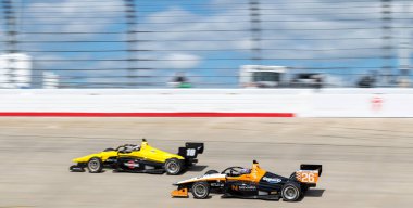 INDY NXT by Firestone Series driver, LOUIS FOSTER (26) of Odiham, England  races through the turns during the Big Machine Music City Grand Prix Presented by Gainbridge at Nashville Superspeedway in Lebanon, TN. clipart