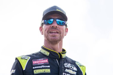 GRANT ENFINGER (9) talks on pit road prior to qualifying for the 28th Annual Baptist Health 200 at Homestead-Miami Speedway in Homestead FL. clipart