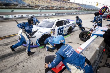 October 26, 2024-Homestead, FL:  The crew of Kaulig Racing  perform a pit stop during the 30th Annual Credit One NASCAR AMEX Credit Card 300 at Homestead Miami Speedway in Homestead FL. clipart