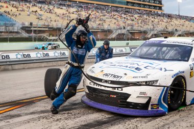 October 26, 2024-Homestead, FL:  The crew of Kaulig Racing  perform a pit stop during the 30th Annual Credit One NASCAR AMEX Credit Card 300 at Homestead Miami Speedway in Homestead FL. clipart