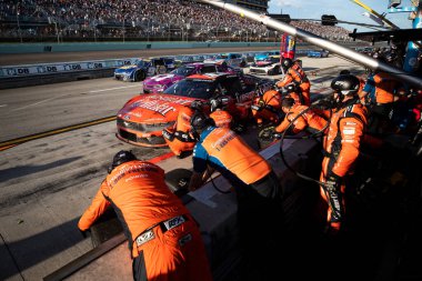 October 27, 2024-Homestead, FL:  The crew of RFK Racing  perform a pit stop during the Straight Talk Wireless 400 at Homestead-Miami Speedway in Homestead FL. clipart