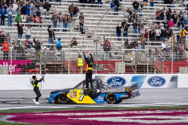 NASCAR Craftsman Truck Series series driver, KYLE BUSCH (7), wins the FR8 208 at the Atlanta Motor Speedway in Hampton, GA, USA. clipart