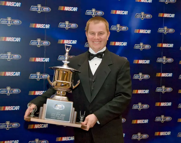 December 07, 2007 - Orlando, FL, USA: 3rd Place driver, Jason Leffler, poses with his trophy at the Portofino Bay Hotel plays host to the NASCAR Busch Series Championship Banquet in Orlando, FL.