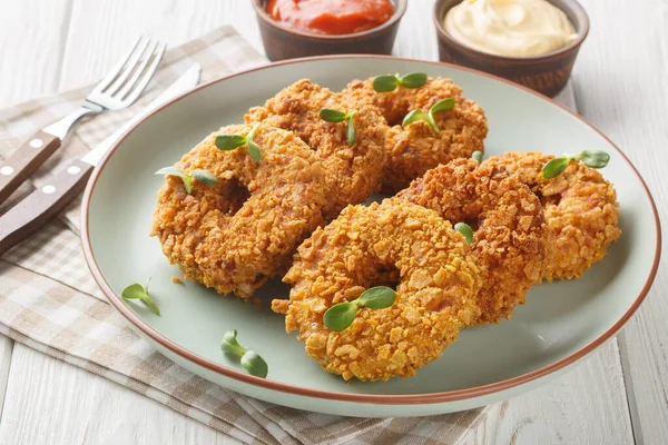 stock image Fried crispy breaded chicken donuts close-up on a plate on the table. Horizonta