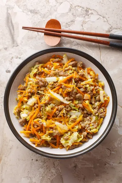 stock image Spring roll bowls packed with pork mince and fresh veggies closeup on the table. Vertical top view from abov