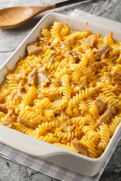 stock image Tuna Mornay Creamy Tuna Casserole Pasta Bake closeup on the baking dish on the table. Vertica