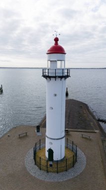 The lighthouse in Hellevoetsluisin the netherlands made with a drone aerial view clipart