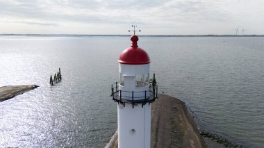 The lighthouse in Hellevoetsluisin the netherlands made with a drone aerial view clipart
