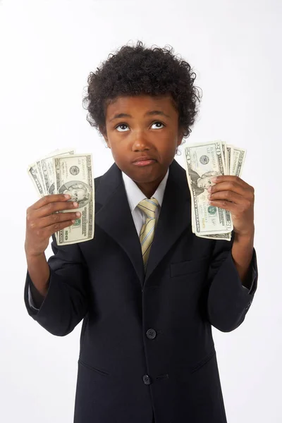 小男孩打扮成一个拥有现金的商人 — 图库照片