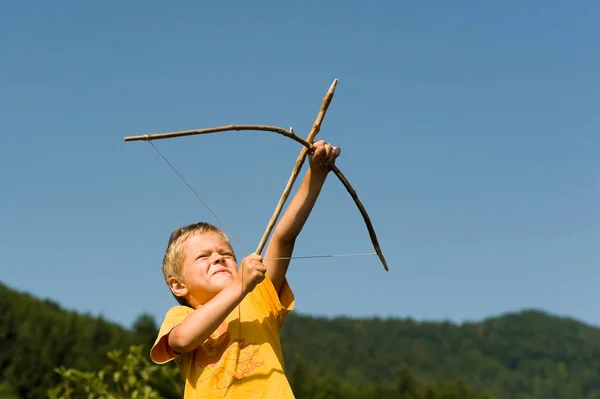 Adorable Boy Shooting Arrow Outdoors — Stock Photo, Image