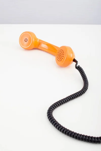 Orange Telephone Receiver Белом Фоне — стоковое фото