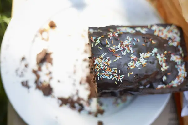 Half Chocolate Cake Sprinkles Plate — Stock Photo, Image