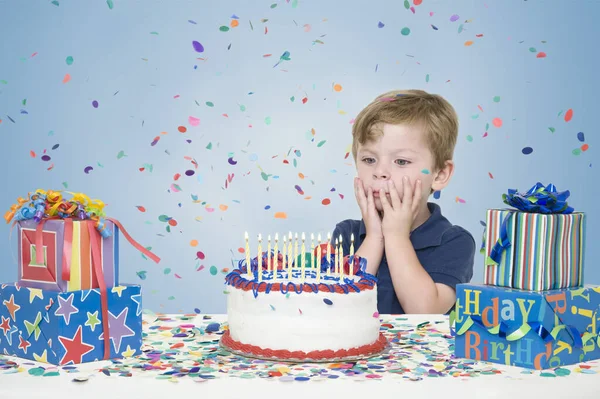 Young Boy Birthday Presents Making Wish Blowing Out Candles Birthday — Stock Photo, Image