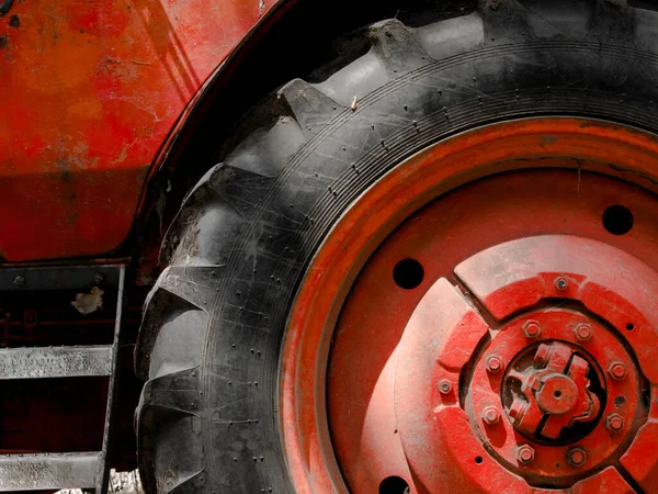 Tires of an old retro and red Soviet tractor
