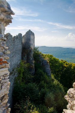 The wall of the Castle of Gymes on the mount in Slovakia clipart