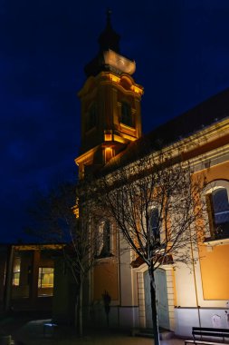 Serbian orthodox church in Hodmezovasarhely at night clipart