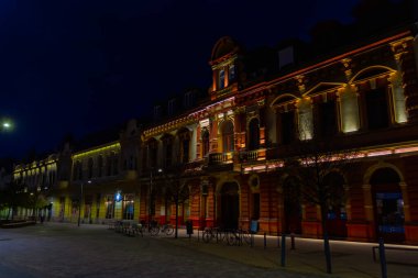 Street of Hodmezovasarhely at night clipart